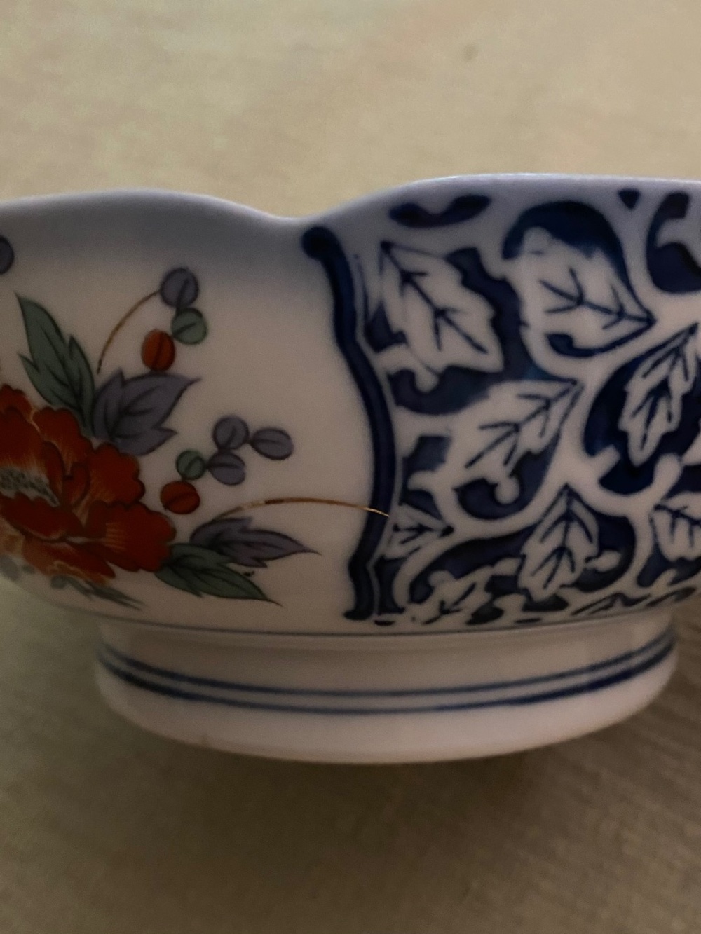 Japanese porcelain bowl beautiful floral with scalloped rim.